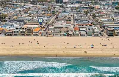 an aerial view of a beach with people on it at Spacious 3Br W Oceanview Patio, Steps To 35Th St Beach By Beachview Rentals in Newport Beach
