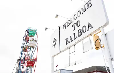 a sign on the side of a building with a crane at Cozy 2Br Oceanview, Half Block To Popular 29Th St Beach By Beachview Rentals in Newport Beach