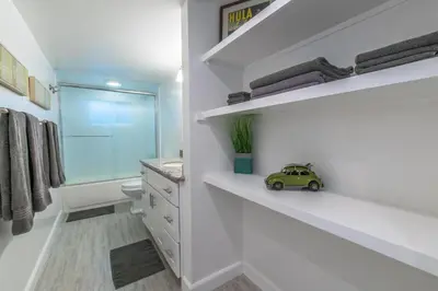 a bathroom with a small toy car on a shelf at Cozy 2Br Oceanview, Half Block To Popular 29Th St Beach By Beachview Rentals in Newport Beach