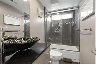 a bathroom with a bowl sink and a toilet at 6Br Oceanview Home W Rooftop Deck, Steps To 40Th St Beach By Beachview Rentals in Newport Beach