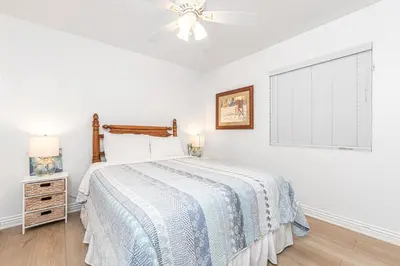 a bedroom with a bed and a ceiling fan at Spacious 4Br W Oceanview Balcony, Ac, Near 40Th St Beach By Beachview Rentals in Newport Beach