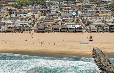 an aerial view of a beach with a crowd of people at Spacious 4Br W Oceanview Balcony, Ac, Near 40Th St Beach By Beachview Rentals in Newport Beach