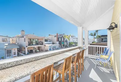 a balcony with chairs and a view of the city at Spacious 4Br W Oceanview Balcony, Ac, Near 40Th St Beach By Beachview Rentals in Newport Beach