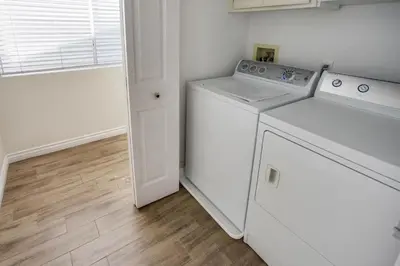 a white washer and dryer in a laundry room at 3Br Oceanview W Prime Peninsula Location Near Beach By Beachview Rentals in Newport Beach
