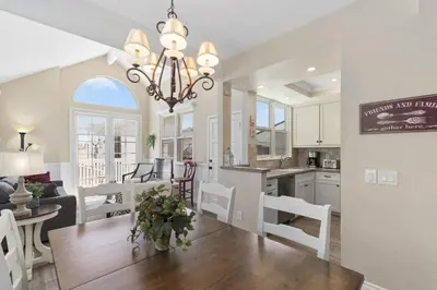 a kitchen and living room with a dining room and a dining table at 3Br Oceanview W Prime Peninsula Location Near Beach By Beachview Rentals in Newport Beach
