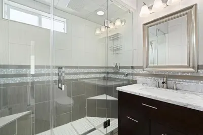 a bathroom with a shower and a sink and a mirror at Cozy 2Br W Ac And Private Patio, Steps To 40Th St Beach By Beachview Rentals in Newport Beach