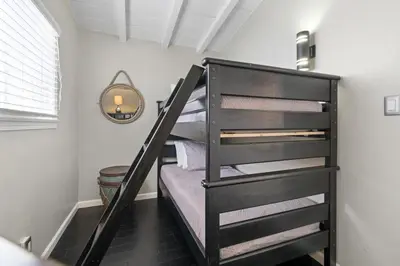 a bunk bed room with bunk beds in a room at Cozy 2Br W Ac And Private Patio, Steps To 40Th St Beach By Beachview Rentals in Newport Beach