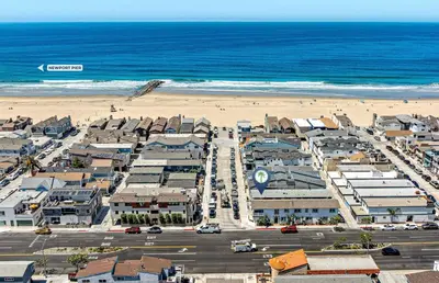 an aerial view of a city and the beach at Renovated 3Br W Stylish Interior Steps From 29Th St Beach By Beachview Rentals in Newport Beach
