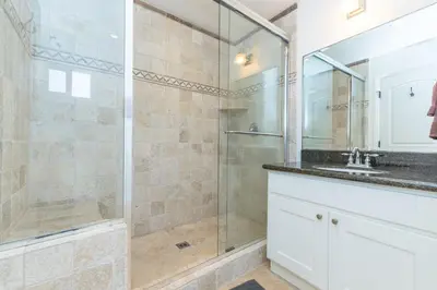 a bathroom with a shower and a sink at Updated 2Br W Ac, Huge Patio, And Grill, One Block To Sand By Beachview Rentals in Newport Beach