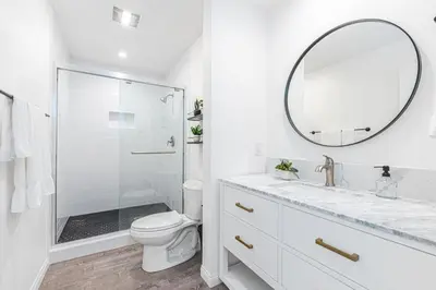 a white bathroom with a sink and a mirror at Modern 2Br W Oceanview Patio, Half Block To 29Th St Beach By Beachview Rentals in Newport Beach