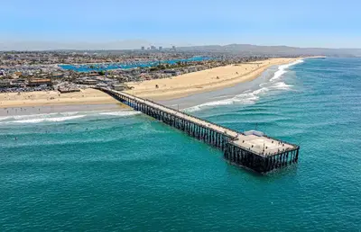 an aerial view of a beach and a pier at Spacious 4Br W Oceanview Balcony, 3 Houses From The Beach By Beachview Rentals in Newport Beach