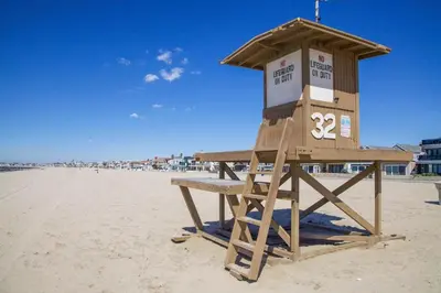 a life guard stand on the beach at Family-Friendly 2Br Beach Home In Prime Walkable Location By Beachview Rentals in Newport Beach