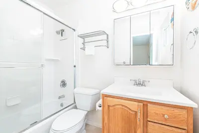 a bathroom with a sink and a toilet and a shower at Family-Friendly 2Br Beach Home In Prime Walkable Location By Beachview Rentals in Newport Beach