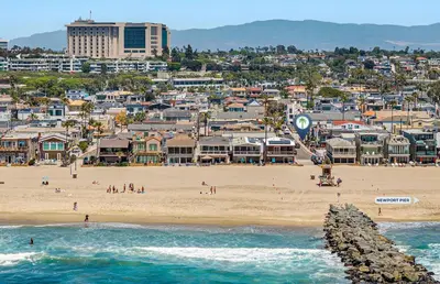 a view of a beach with a city and buildings at Upgraded Pet-Friendly Home Steps From Popular 40Th St Beach By Beachview Rentals in Newport Beach