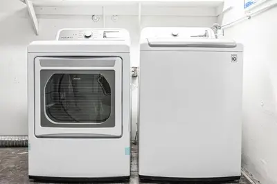 a white refrigerator and a stove in a room at Upgraded Pet-Friendly Home Steps From Popular 40Th St Beach By Beachview Rentals in Newport Beach