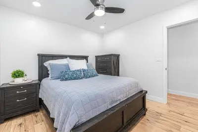 a bedroom with a bed and a ceiling fan at Remodeled 3Br W Oceanview Patio, Ac, 4 Houses From Sand By Beachview Rentals in Newport Beach