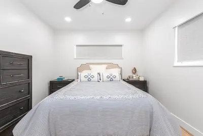 a white bedroom with a bed and a ceiling fan at Remodeled 3Br W Oceanview Patio, Ac, 4 Houses From Sand By Beachview Rentals in Newport Beach