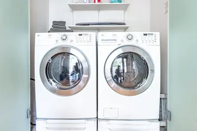 two washing machines sitting next to each other at Updated 3Br Beach Home W Patio And Bbq, In Prime Location By Beachview Rentals in Newport Beach