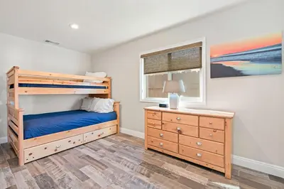 a bedroom with a bunk bed and a dresser at Cozy 2Br Cottage W Ac, Prime Location One House From Sand By Beachview Rentals in Newport Beach