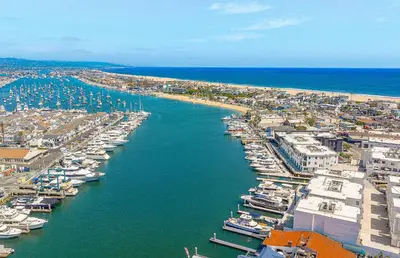 an aerial view of a harbor with boats in the water at Luxury 4Br Tri-Level W Modern Interior, Rooftop Deck, Ac By Beachview Rentals in Newport Beach