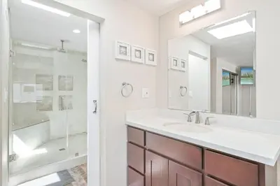 a bathroom with a sink and a shower at Stylish 2Br Upstairs Cottage W Ac One House From Beach By Beachview Rentals in Newport Beach