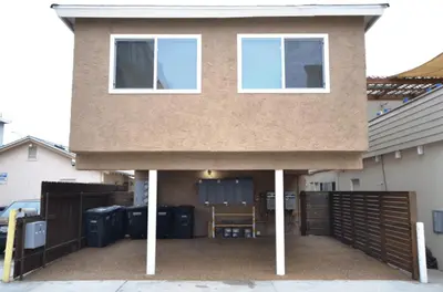 a house with a gate and a fence at Stylish 2Br Upstairs Cottage W Ac One House From Beach By Beachview Rentals in Newport Beach