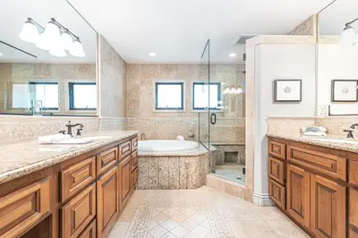 a bathroom with two sinks and a tub at Luxury 5Br Vacation Home W Rooftop Deck, Ocean Views, Ac By Beachview Rentals in Newport Beach