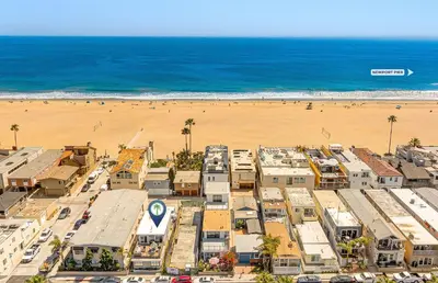 an aerial view of a city and the beach at Cozy 2Br W Large Deck, Steps From Marina Park And Beach By Beachview Rentals in Newport Beach