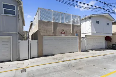 a house with a white fence and a garage at Quiet 4Br Home W Large Deck And Bbq, 2 Blocks From Sand By Beachview Rentals in Newport Beach