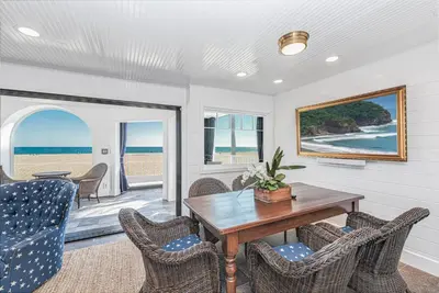 a dining room with a table and chairs at Spectacular 6Br Oceanfront Home In Highly-Coveted Location By Beachview Rentals in Newport Beach