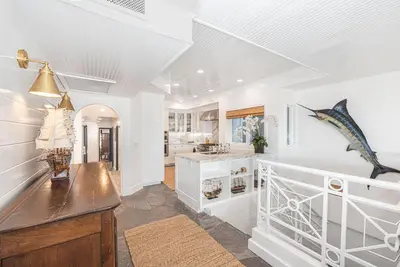 a kitchen with white walls and a ceiling at Spectacular 6Br Oceanfront Home In Highly-Coveted Location By Beachview Rentals in Newport Beach