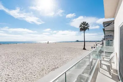 a view of the beach from the balcony of a beach house at 3Br Oceanfront In Desirable Location At Excellent Value By Beachview Rentals in Newport Beach