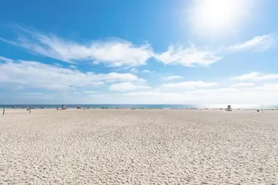 a sandy beach with the ocean in the background at 3Br Oceanfront In Desirable Location At Excellent Value By Beachview Rentals in Newport Beach