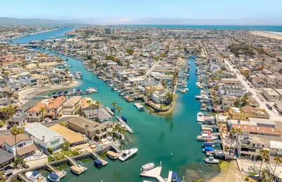 an aerial view of a harbor with boats in the water at 3Br W Oceanview Patio, 1 House From Popular 40Th St Beach By Beachview Rentals in Newport Beach
