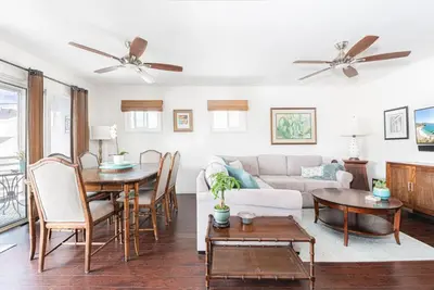 a living room with a couch and a table at Affordable 2Br, Central Location, Walk To Beach And Dining By Beachview Rentals in Newport Beach