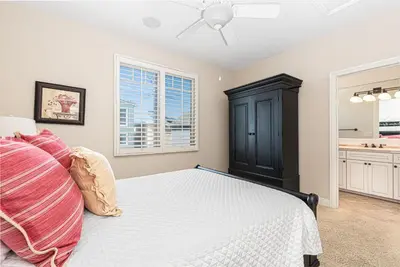 a bedroom with a bed and a ceiling fan at Darling 3Br Beach Home On Quiet Street, Easy Walk To Beach By Beachview Rentals in Newport Beach
