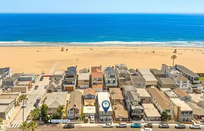 an aerial view of a resort with a beach at Charming 3Br W Large Deck, Walk To Beach And Marina Park By Beachview Rentals in Newport Beach