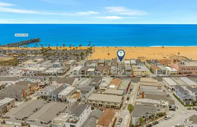 an aerial view of a city and the beach at 3Br Oceanfront W Panoramic Views In Prime Central Location By Beachview Rentals in Newport Beach