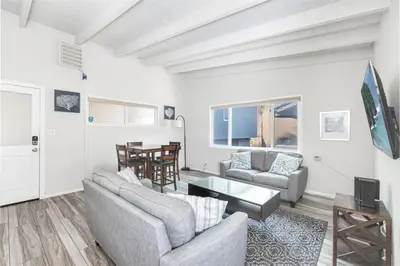 a living room with two couches and a table at 8Br Coastal Getaway W Gorgeous Views At An Excellent Value By Beachview Rentals in Newport Beach