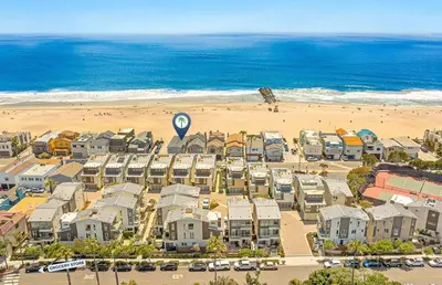 an aerial view of a beach with houses and a hot air balloon at Renovated 3Br Oceanfront W Panoramic Views By Beachview Rentals in Newport Beach