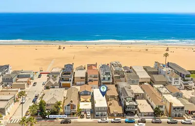 an aerial view of a beach with houses and the ocean at Affordable Studio, Steps From Beach And Marina Park By Beachview Rentals in Newport Beach