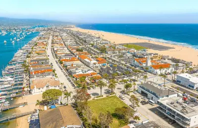 an aerial view of a beach and the ocean at 6Br Oceanfront Duplex, Ac, Steps To Beach And Balboa Pier By Beachview Rentals in Newport Beach