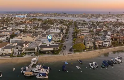 an aerial view of a city with boats in the water at Updated 1Br Bayfront Cottage W Deck In Quiet Balboa Island By Beachview Rentals in Newport Beach