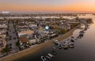 an aerial view of a city with boats in the water at Updated 1Br Bayfront Cottage W Deck In Quiet Balboa Island By Beachview Rentals in Newport Beach