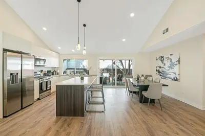 an open kitchen with a table and a dining room at Neat Retreat w Hot Tub Near Beach and Downtown in San Diego