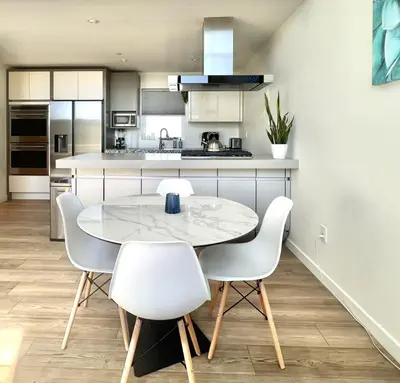 a kitchen with a table and chairs in a room at Private Rooftop Retreat with Stunning City Views in San Diego