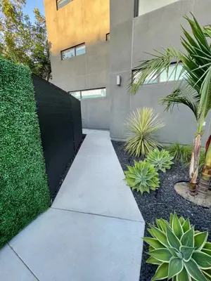a walkway in front of a building with plants at Private Rooftop Retreat with Stunning City Views in San Diego