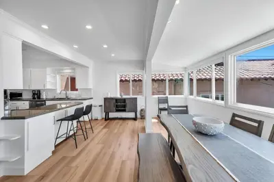 a kitchen with a table and a counter top at Stunning 3BR Capo Beach Home with Ocean Views in Dana Point