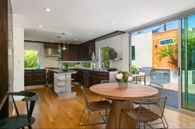 a kitchen and dining room with a table and chairs at Sunset Cliffs Dream Home Ocean View Family Getaway in San Diego