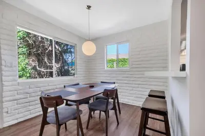 a dining room with a table and chairs at Comfortable Carlsbad 2BR Beach Home Walk to Beach in Carlsbad